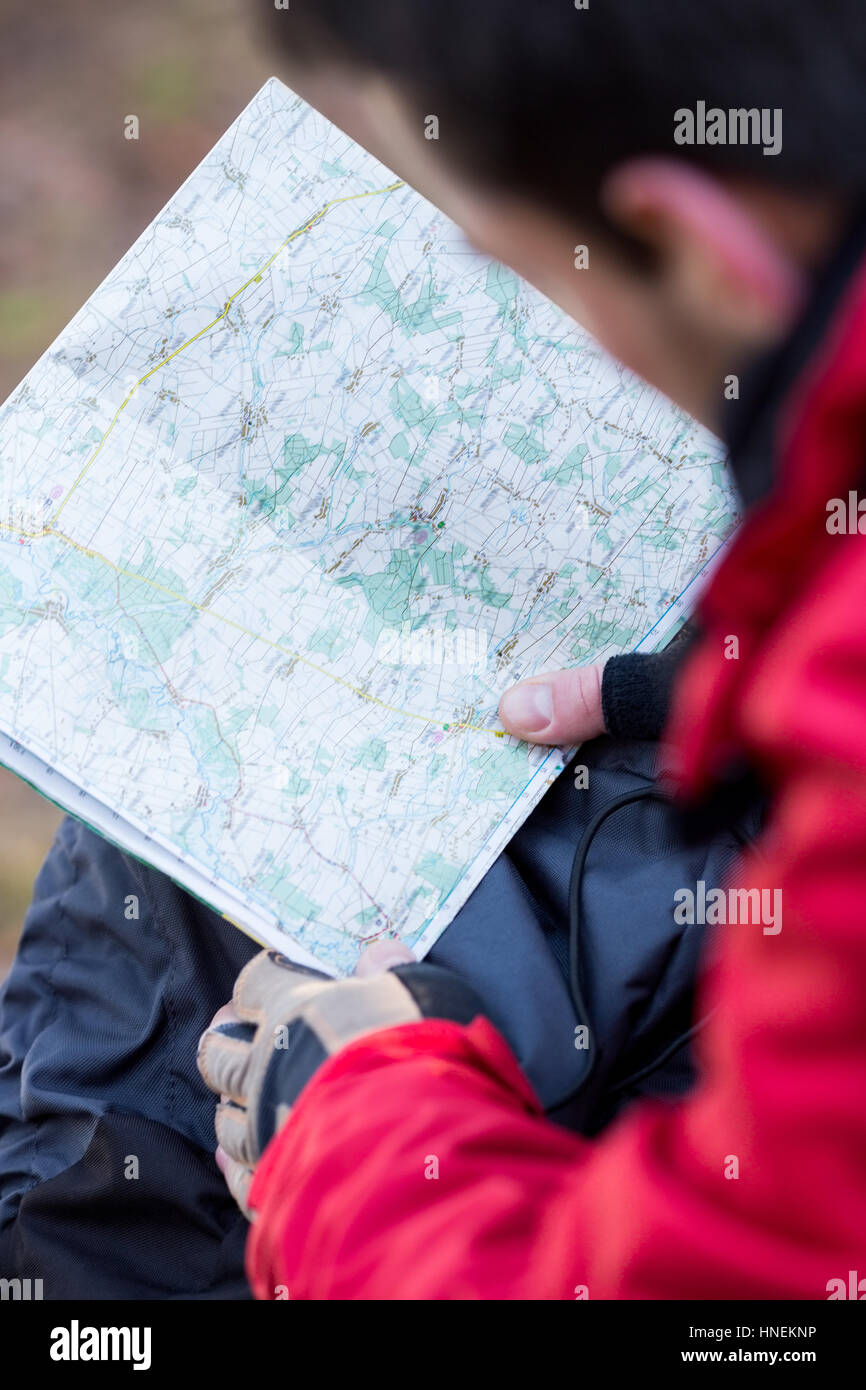 Cropped image of male hiker reading map Stock Photo