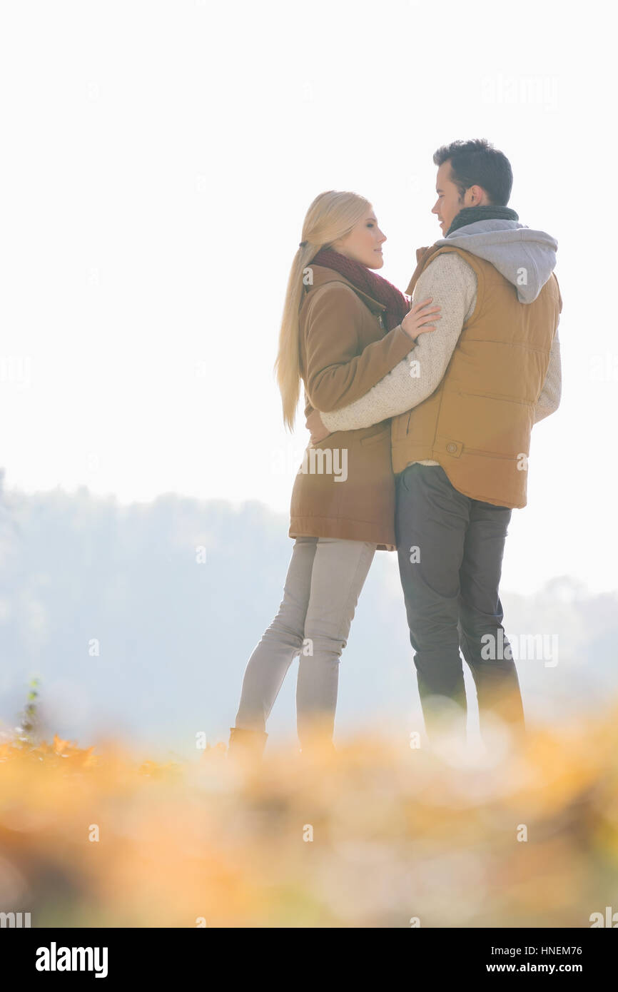 Couple hugging during autumn in park Stock Photo