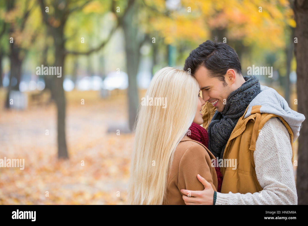 Loving couple hugging in park Stock Photo