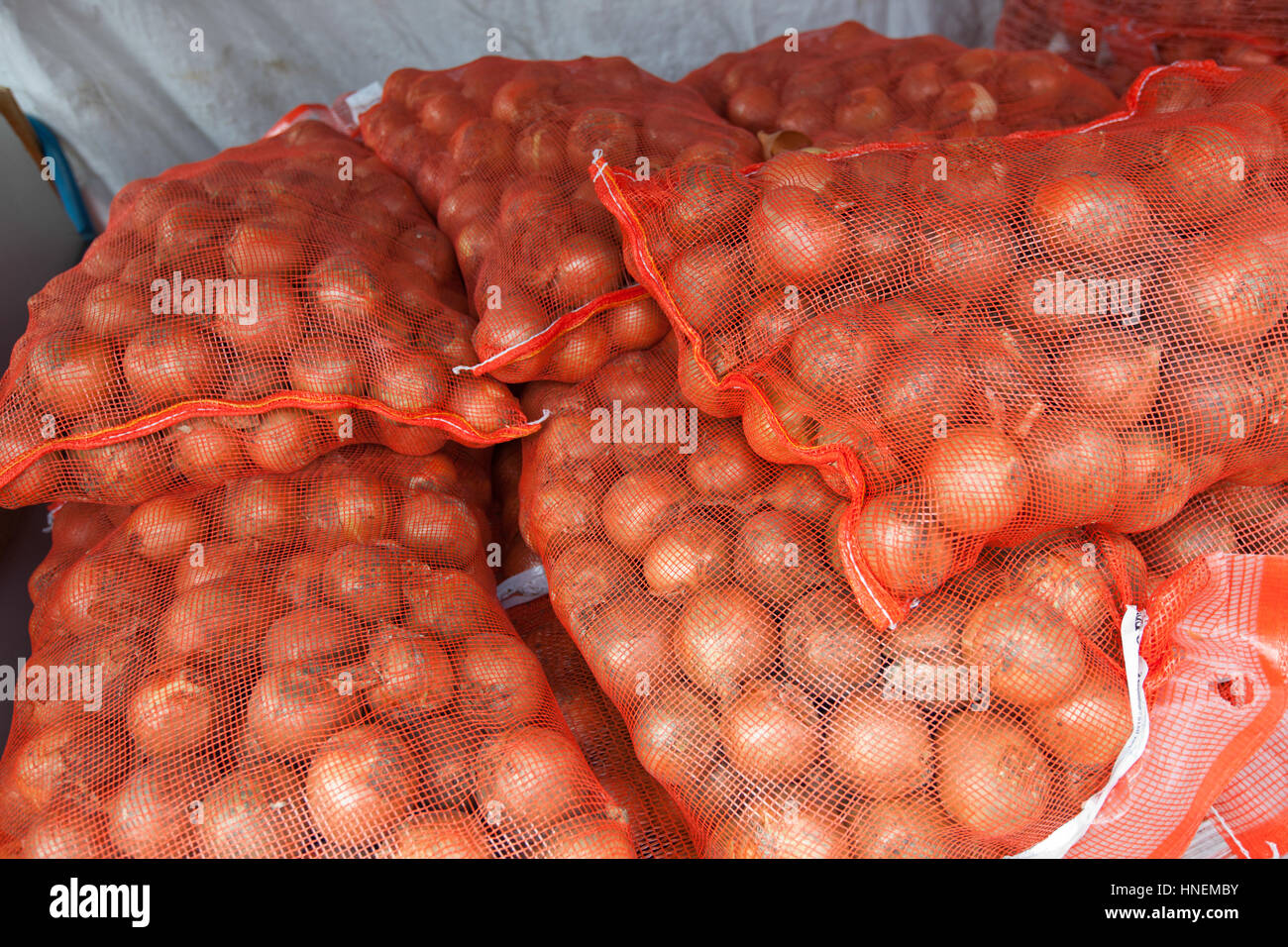 Stack of onion sacks in grocery store Stock Photo Alamy