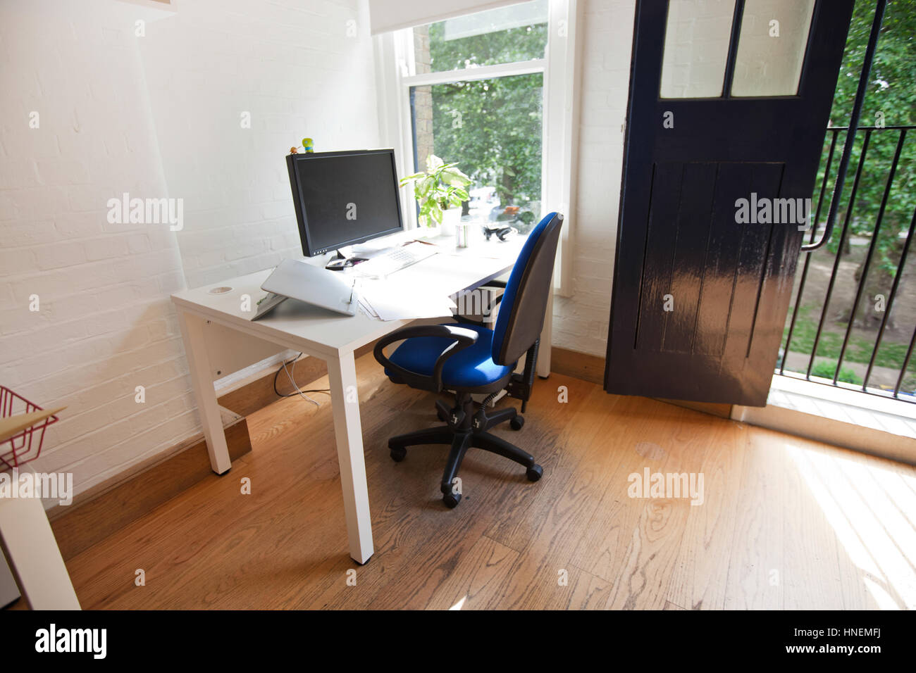 Interior of office with computer on desk Stock Photo