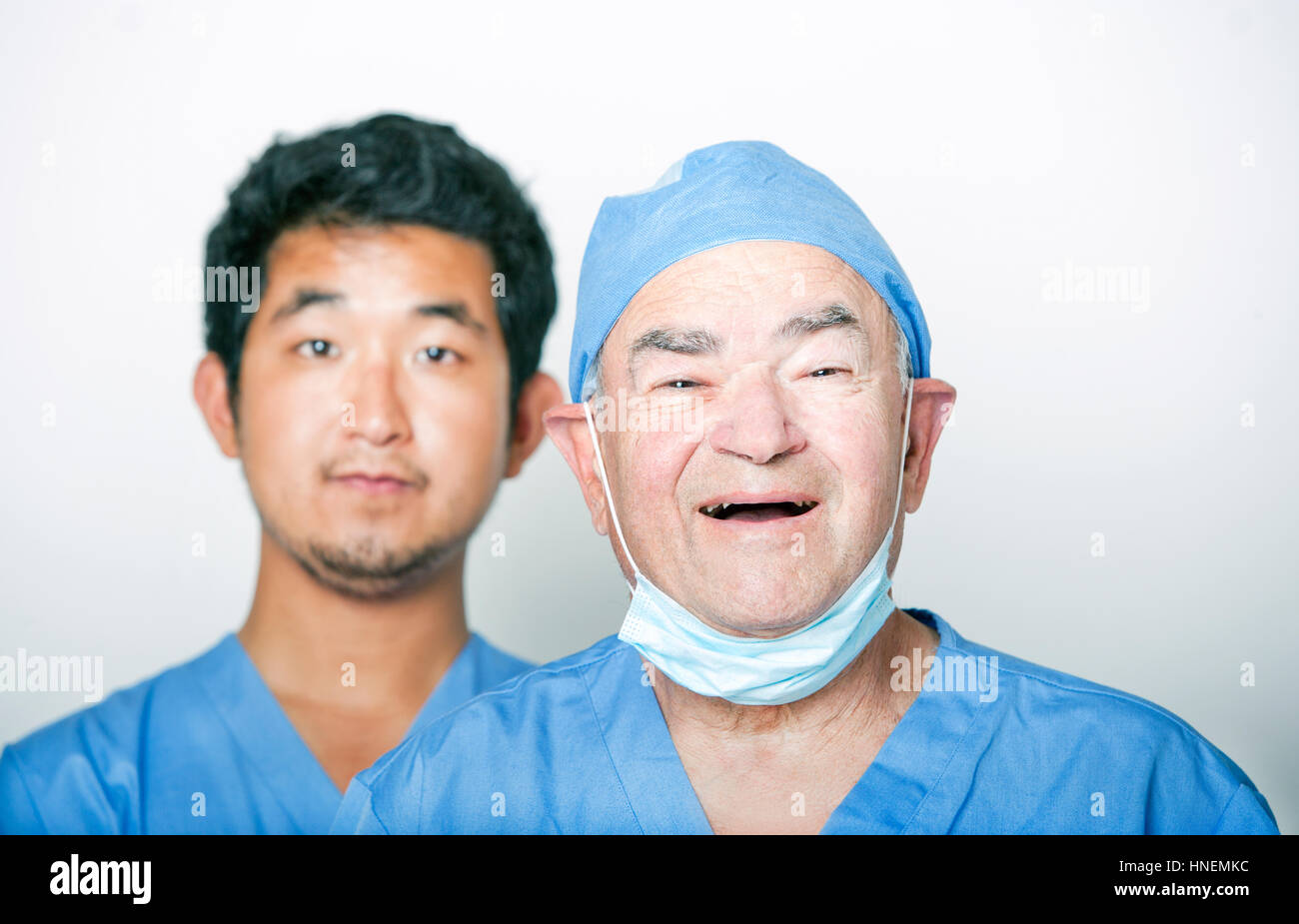 A portrait of Senior adult surgeon and a young Asian doctor Stock Photo