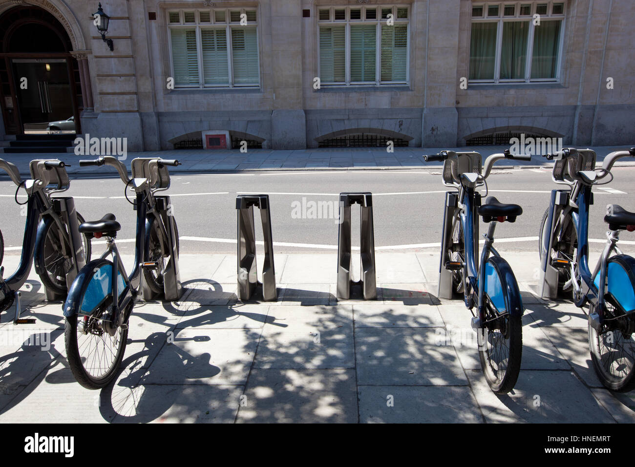 Public Rental Bicycles in a Line, London, UK Stock Photo