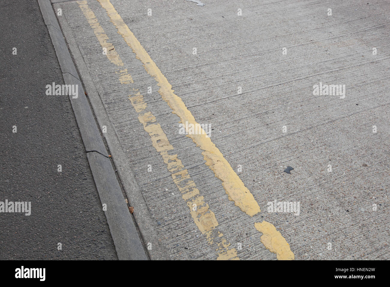 Close-Up of double yellow line on road Stock Photo