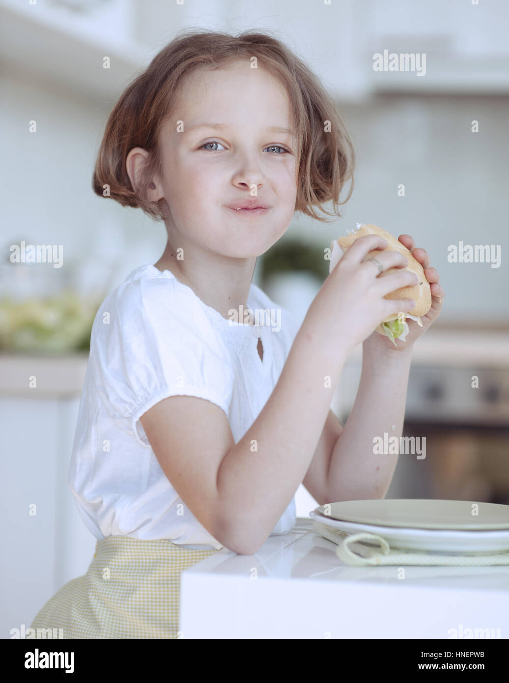 Beautiful Young Girl eating sandwich Stock Photo