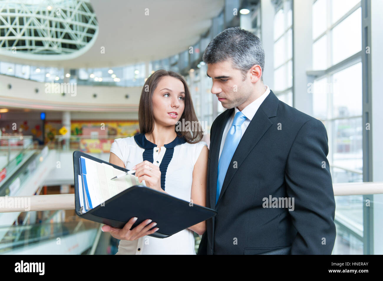 Businessman and woman discussing work Stock Photo
