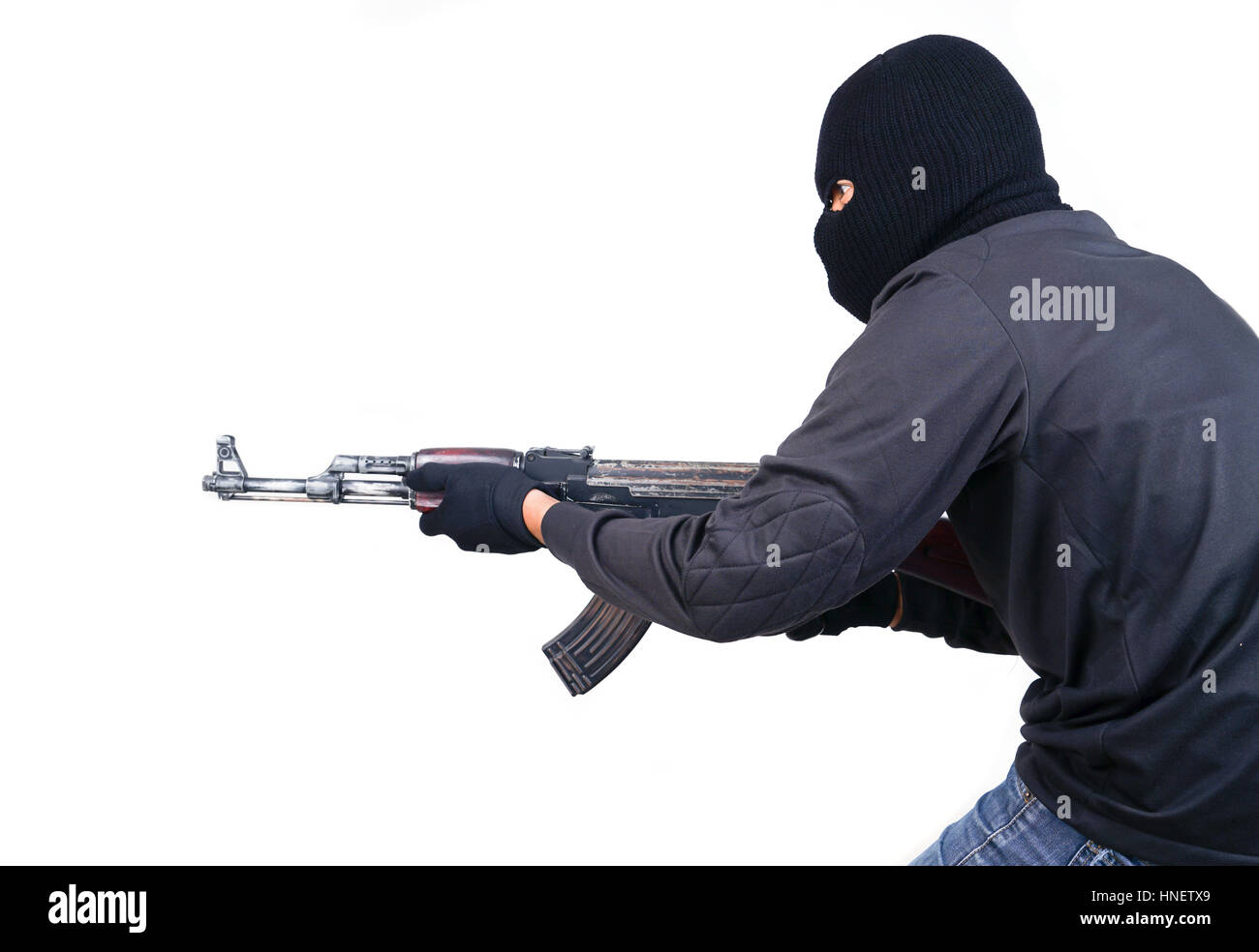 terrorist with ak47 machine gun isolated on white background Stock Photo