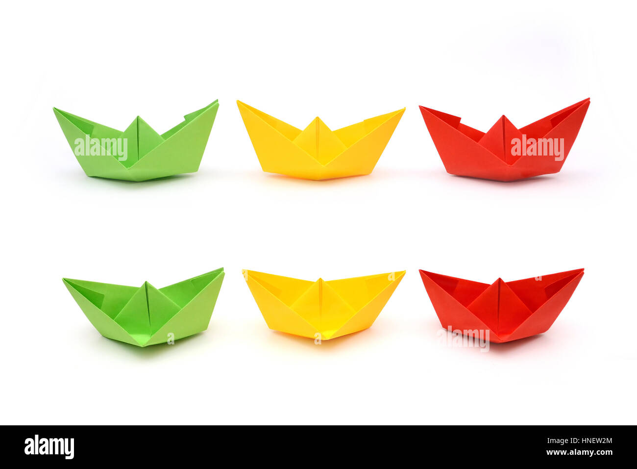 Colored paper boats, origami. Green, yellow and red paper Stock Photo
