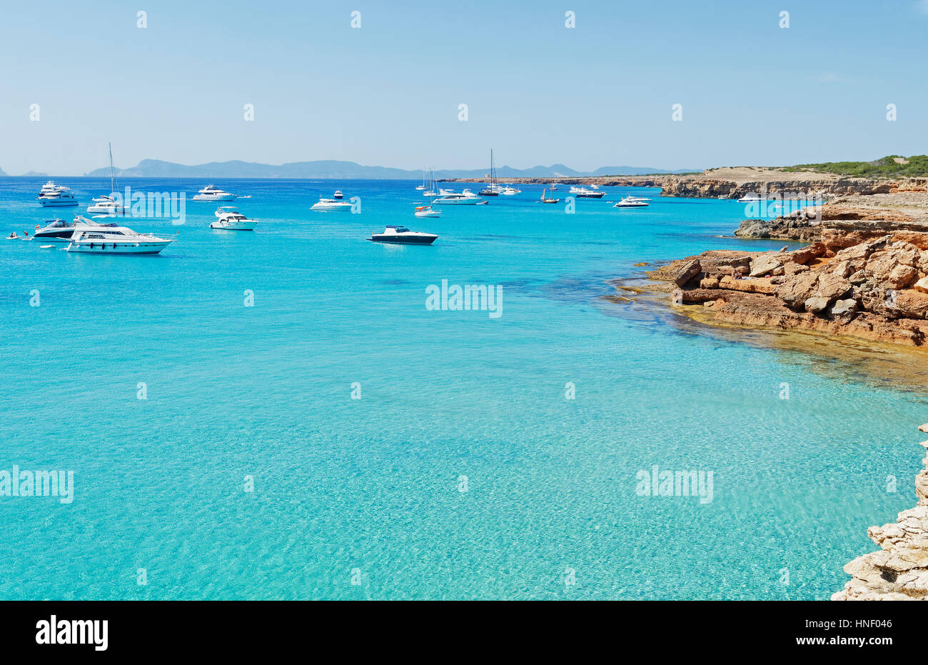 Boats in turquoise water, Formentera, Baleric Islands, Spain Stock Photo