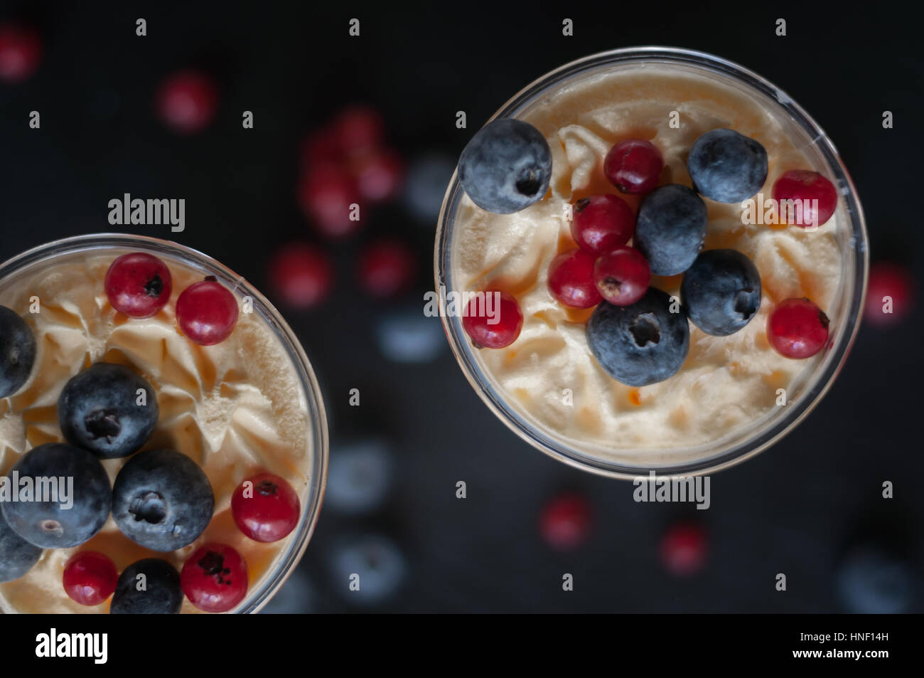 vanilla ice cream with berries of blueberry and currant Stock Photo - Alamy