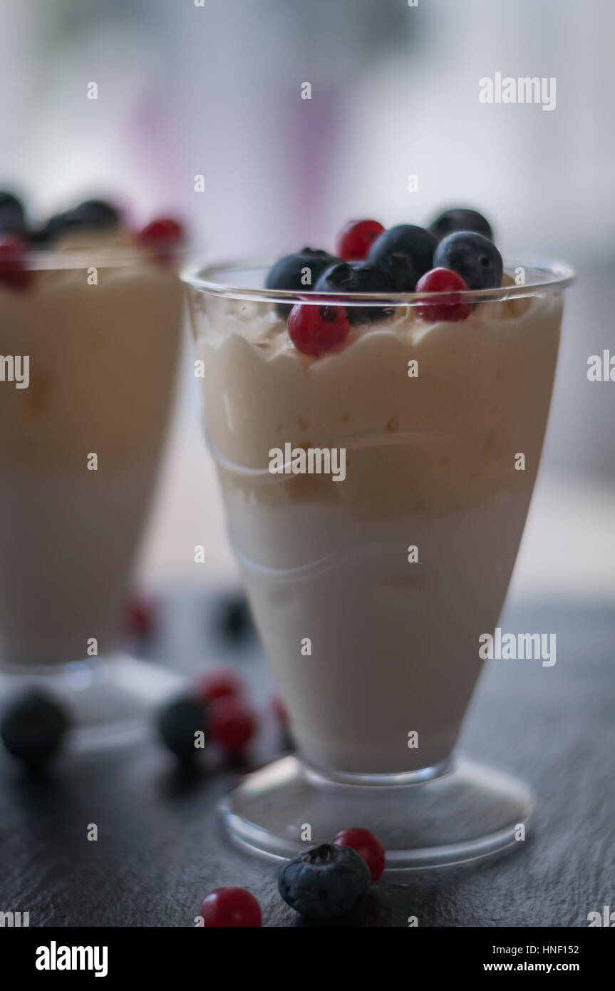 vanilla ice cream with berries of blueberry and currant Stock Photo - Alamy