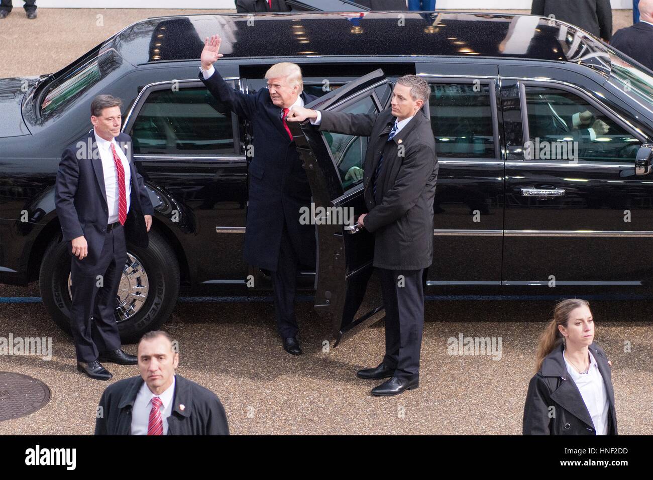 U.S. President Donald Trump waves to the crowd as he arrives at the ...