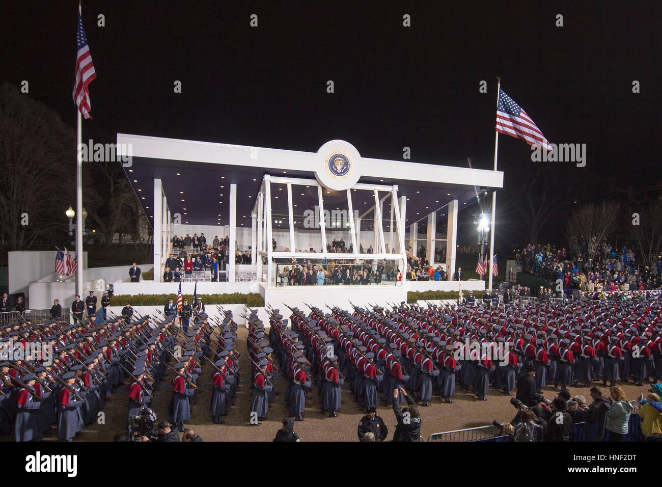 U.S. President Donald Trump and Vice President Mike Pence observe the 58th Presidential Inauguration Parade from the White House reviewing stand January 20, 2017 in Washington, DC. Stock Photo