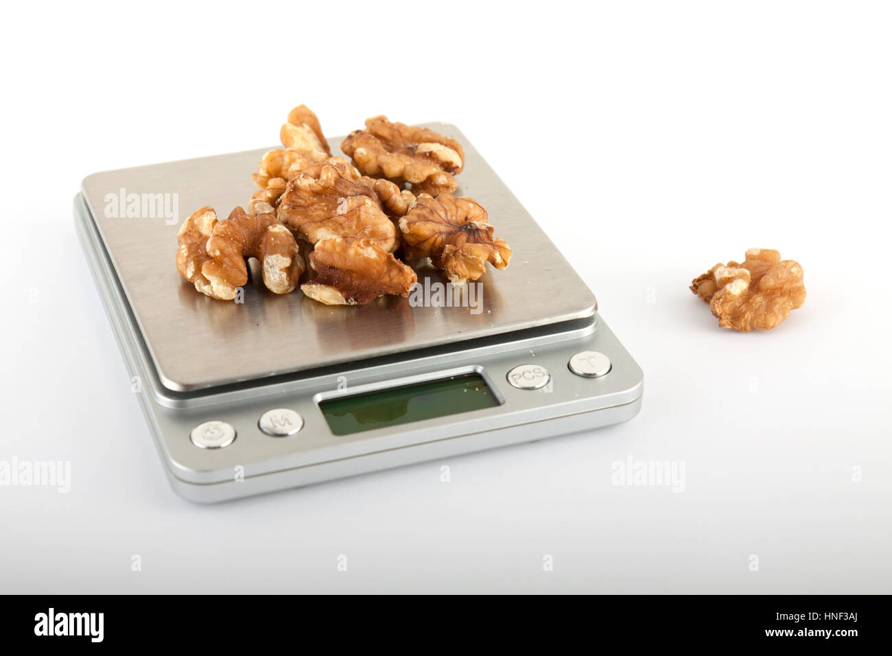 Weighing nuts on the digital scale Stock Photo Alamy
