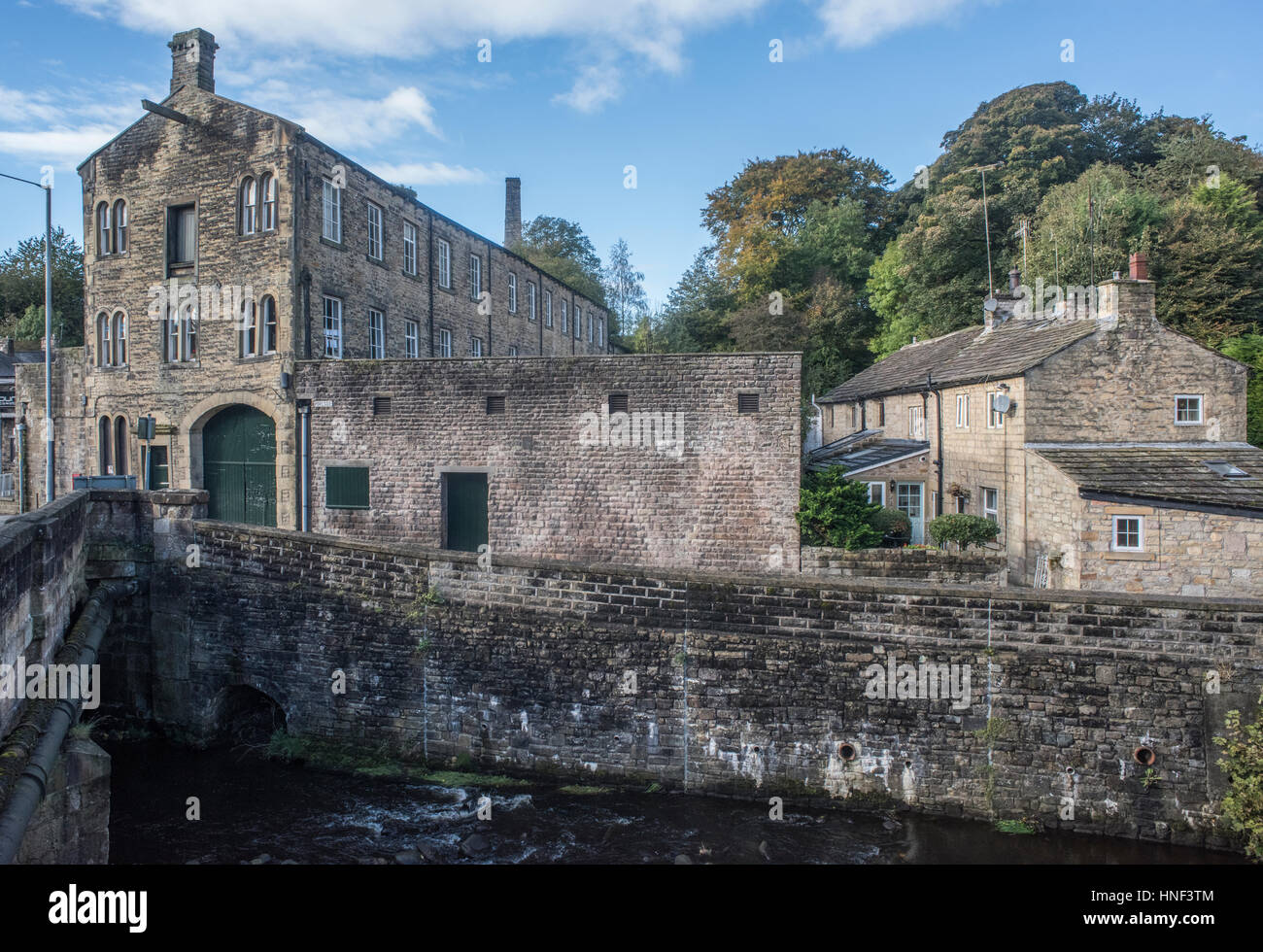 19th century cottages and mill, besides Pendle Water, Barrowford, Colne, Lancashire, an echo of the textile industry Stock Photo