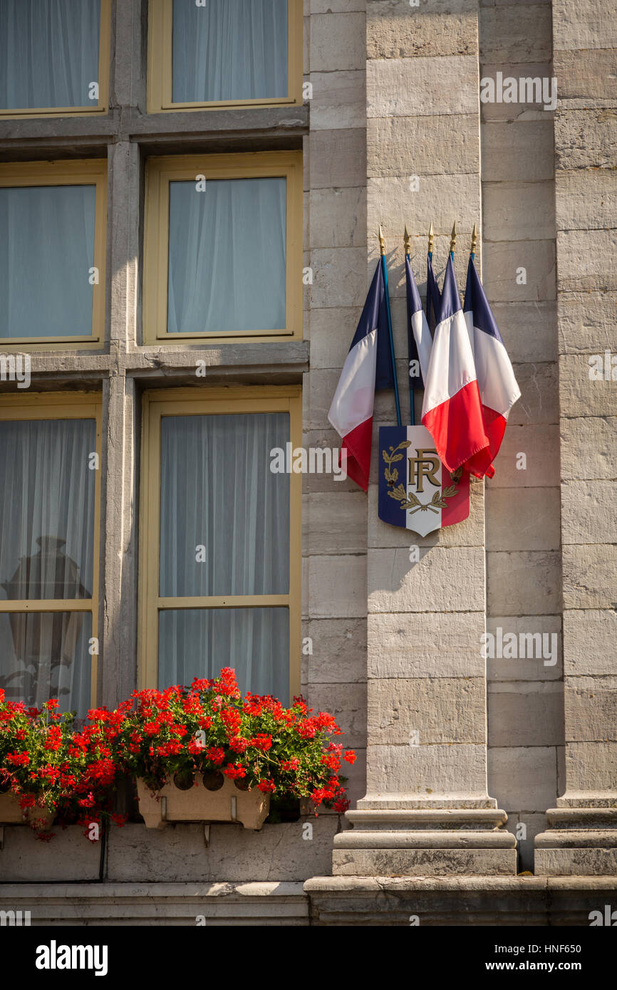 Flags on the outside of the Mairie, Place de la République, Bergues, Hauts-de-France, France, Europe. Stock Photo