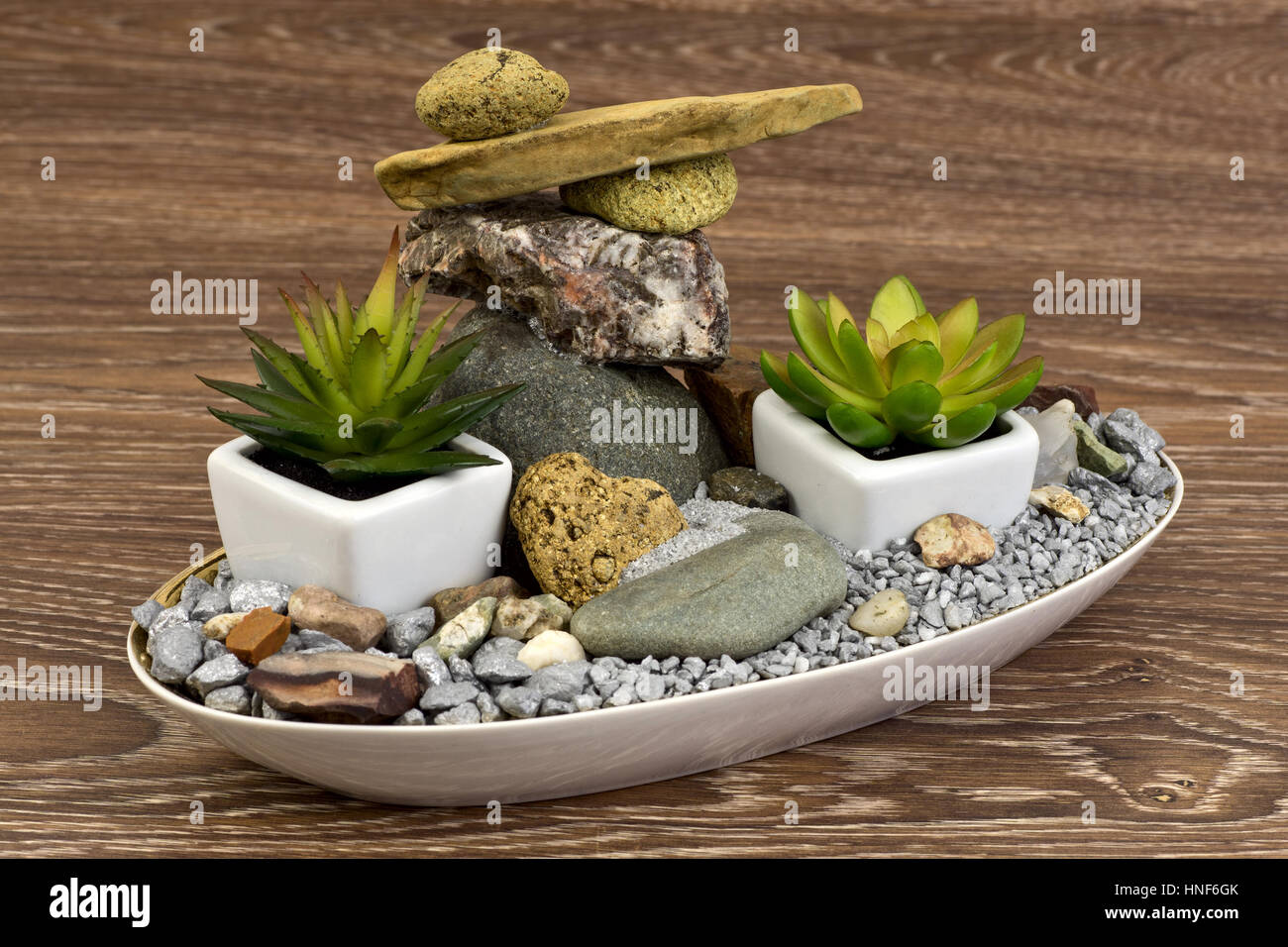Mini-garden with balanced stones and succulents Stock Photo