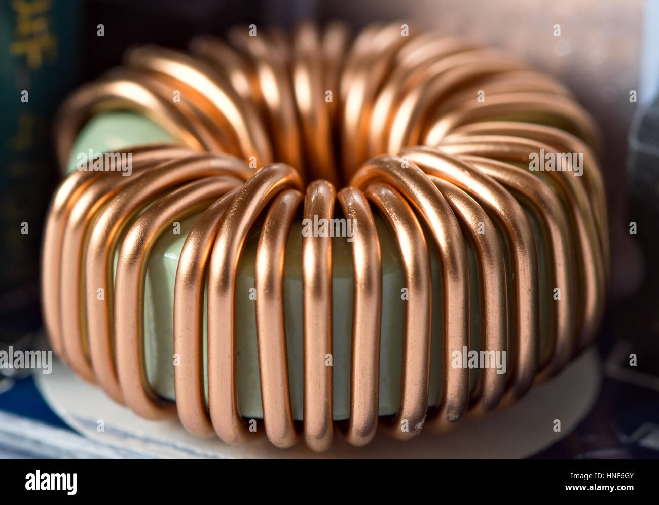 Inductance coil with ferrite toroid on circuit board Stock Photo