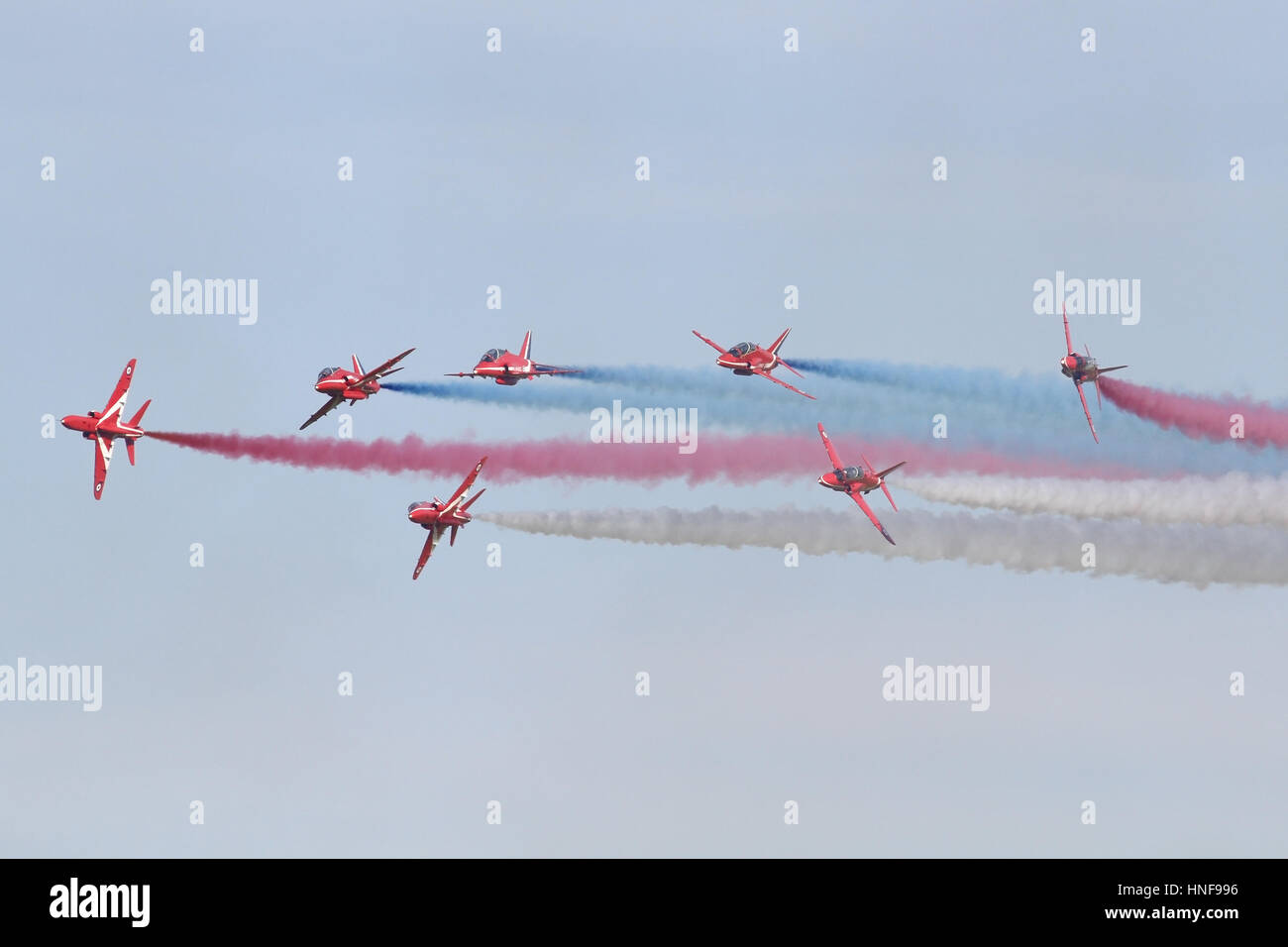 Royal Air Force Display team, The Red Arrows breaking towards the crowd line during a Duxford airshow. Stock Photo