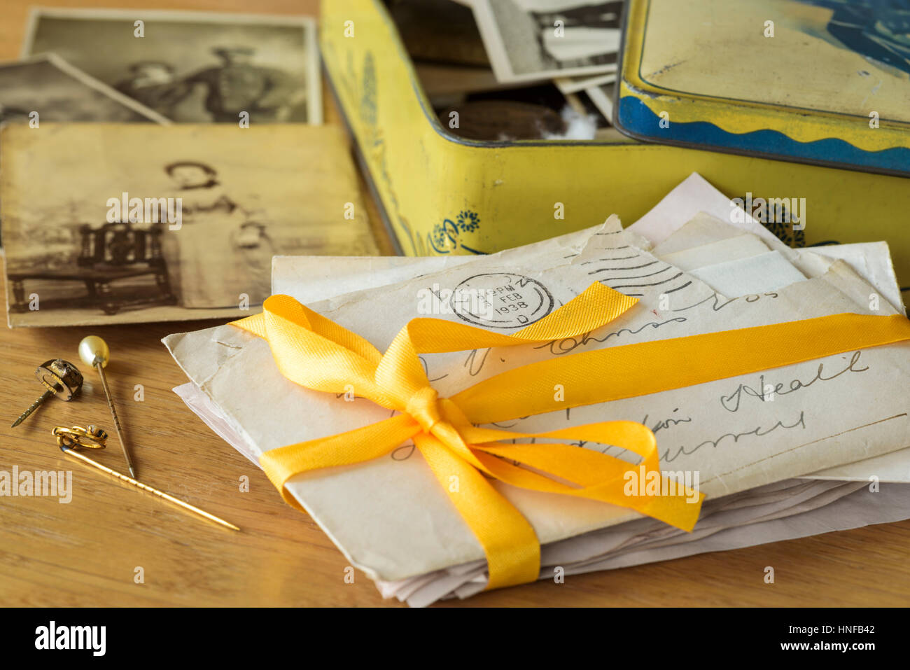 Old photographs and letters.Memories in an old tin. Stock Photo