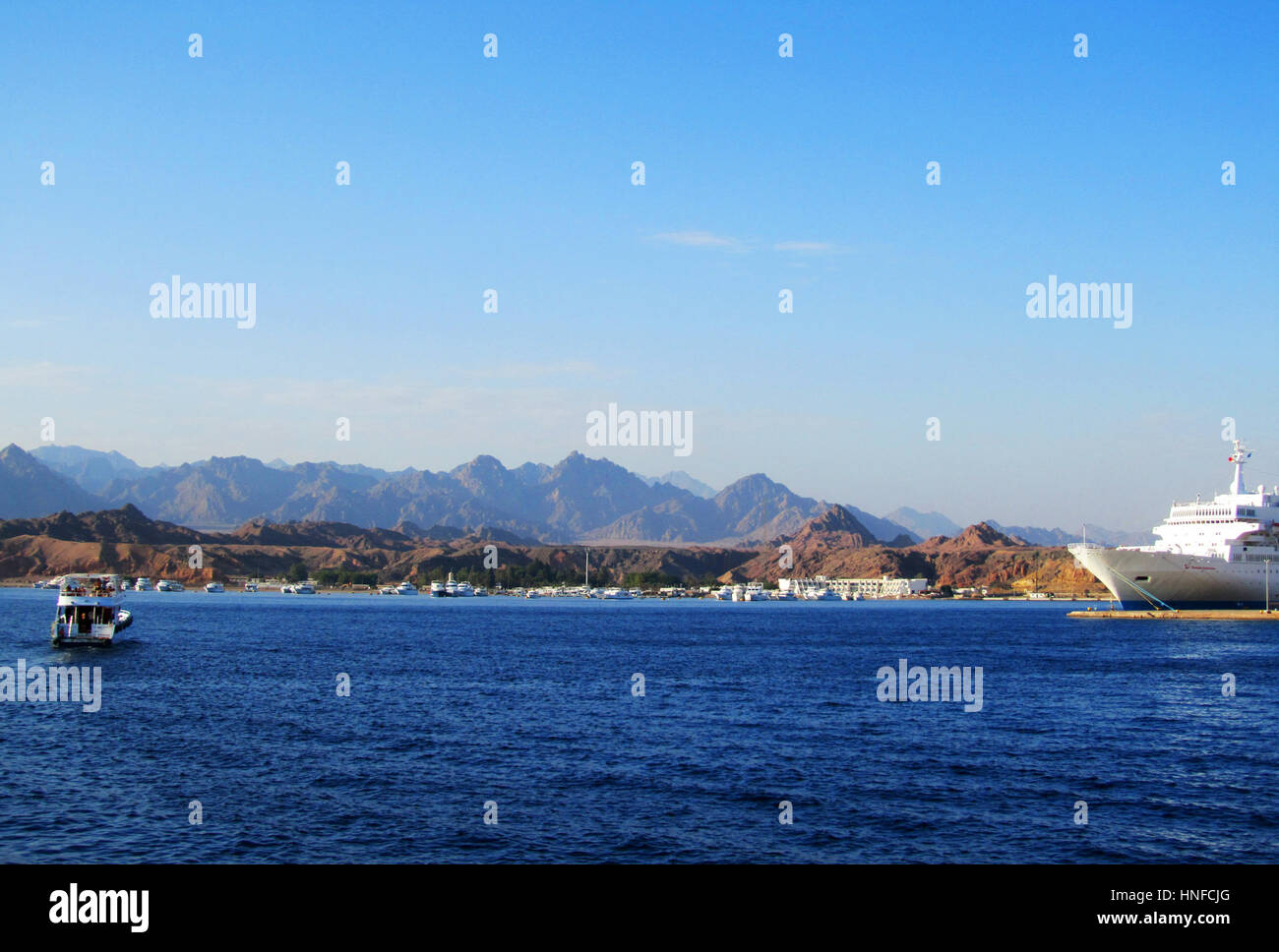 Boat and Ship at Red Sea with mountains in background Stock Photo - Alamy
