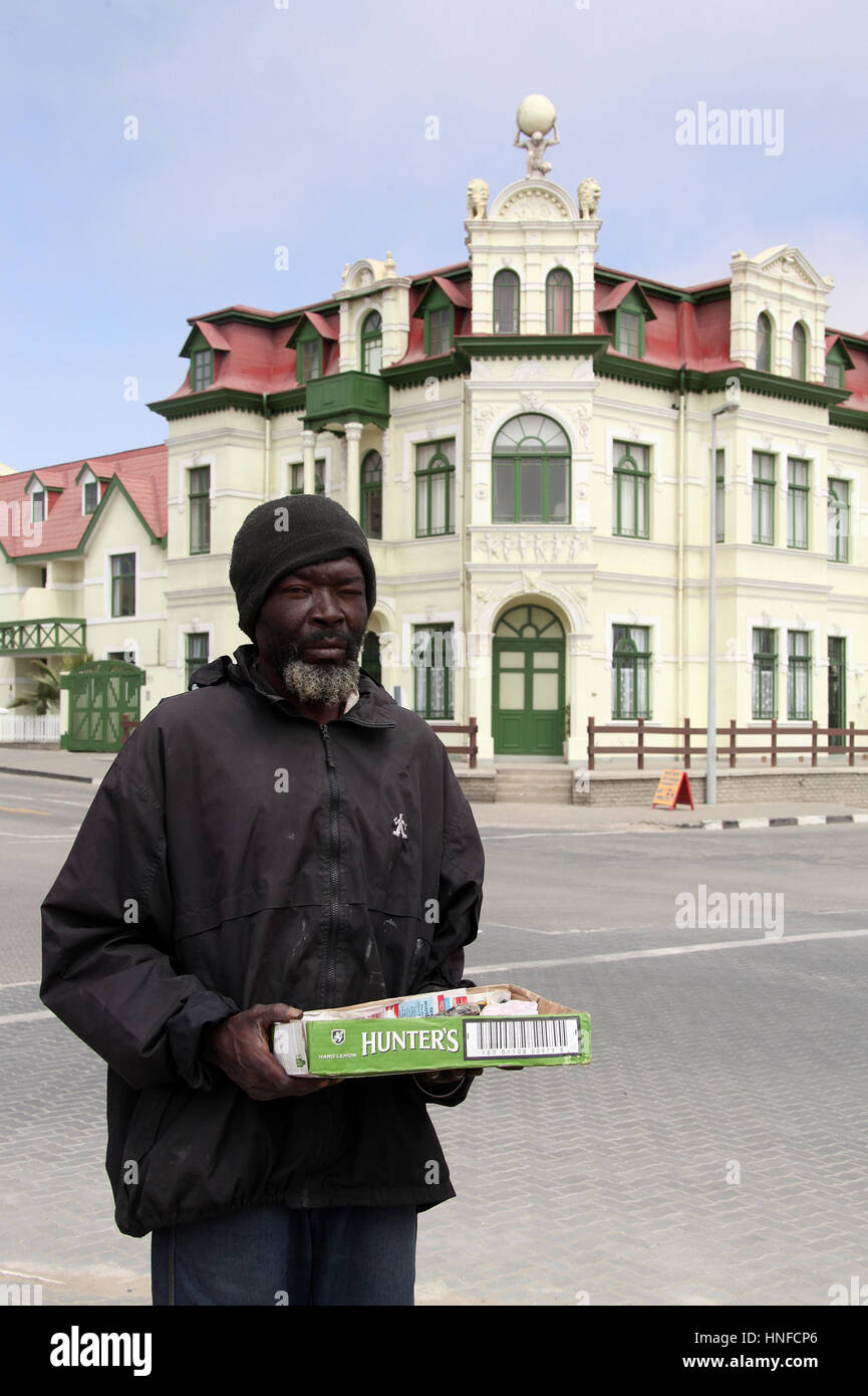 Man selling rock samples in front of Haus Hohenzollern at Swakopmund ...
