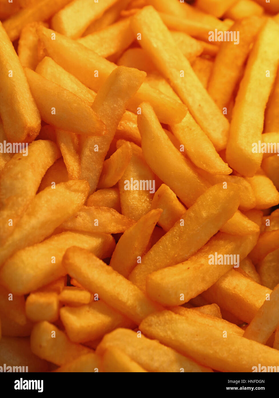 French fries, unhealthy deep fried potato chips close up, high angle view Stock Photo