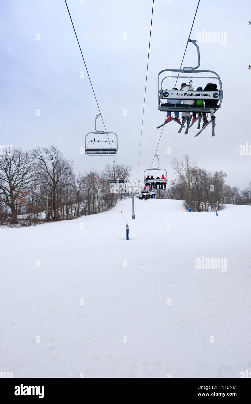 Boler Mountain Ski Club chairlift transporting skiers up hill ...