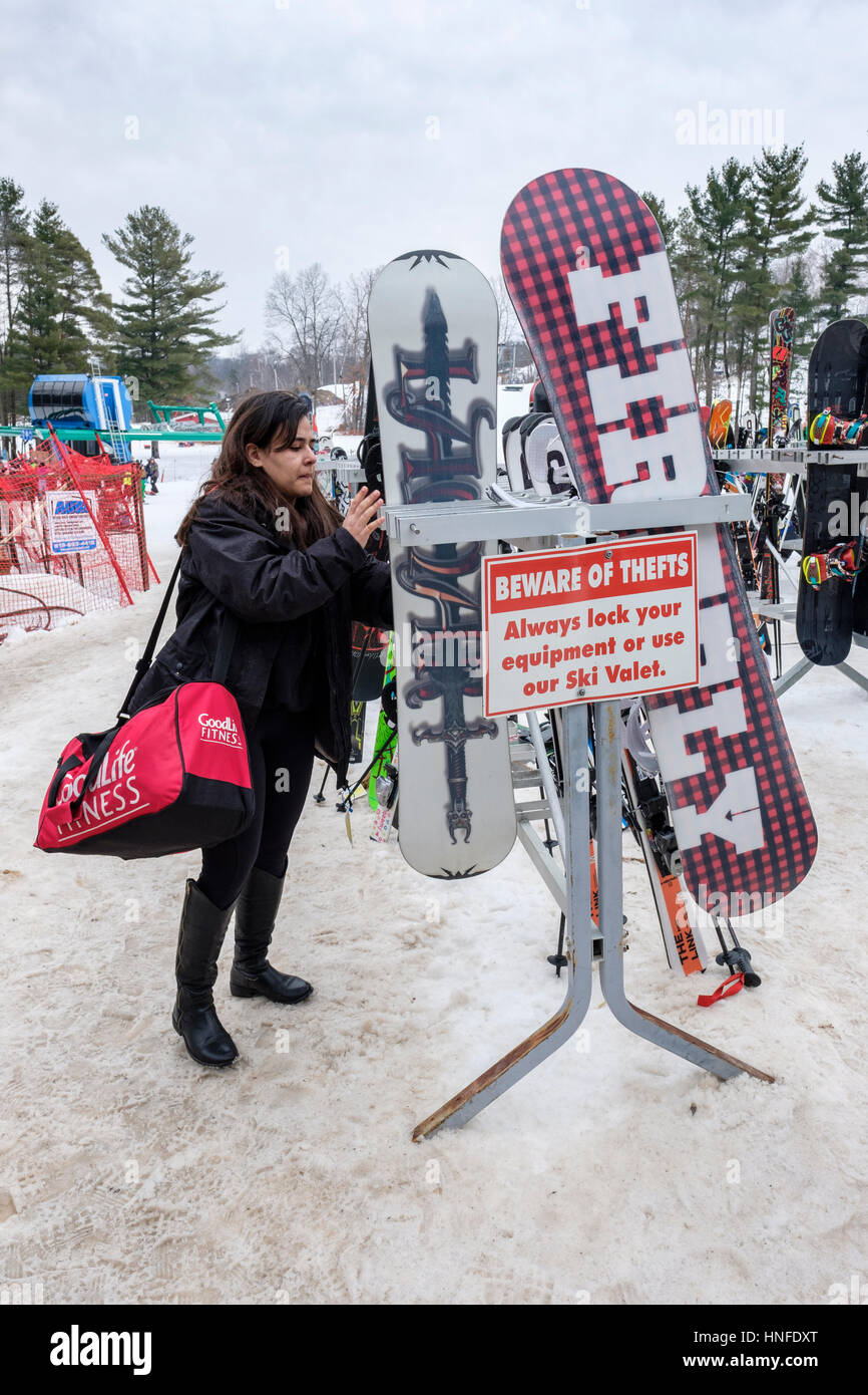 Ski / snowboard rack with a theft warning sign at Boler Mountain ...