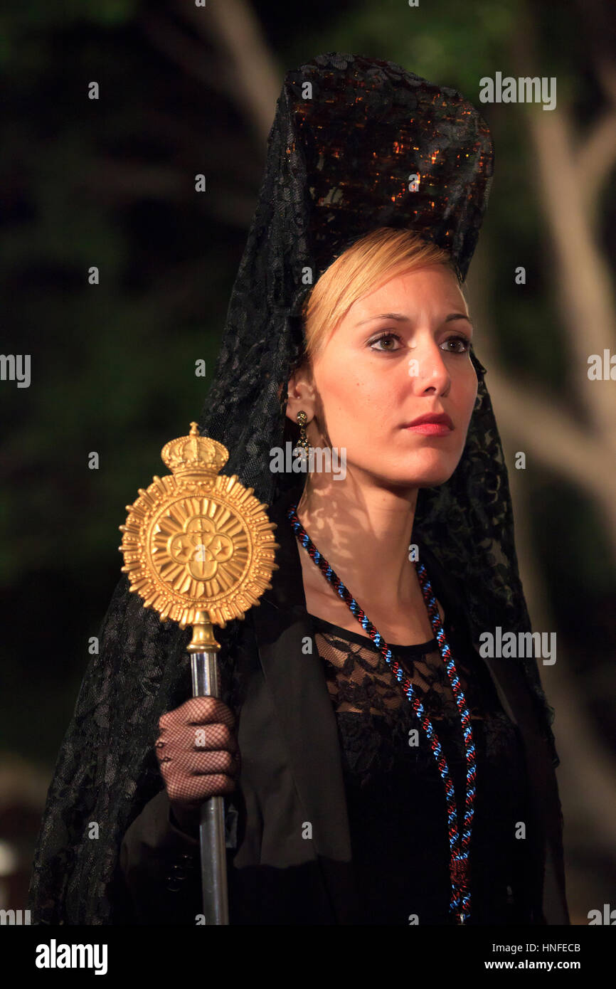 A Spanish lady wearing the traditional mantilla during Semana Santa in