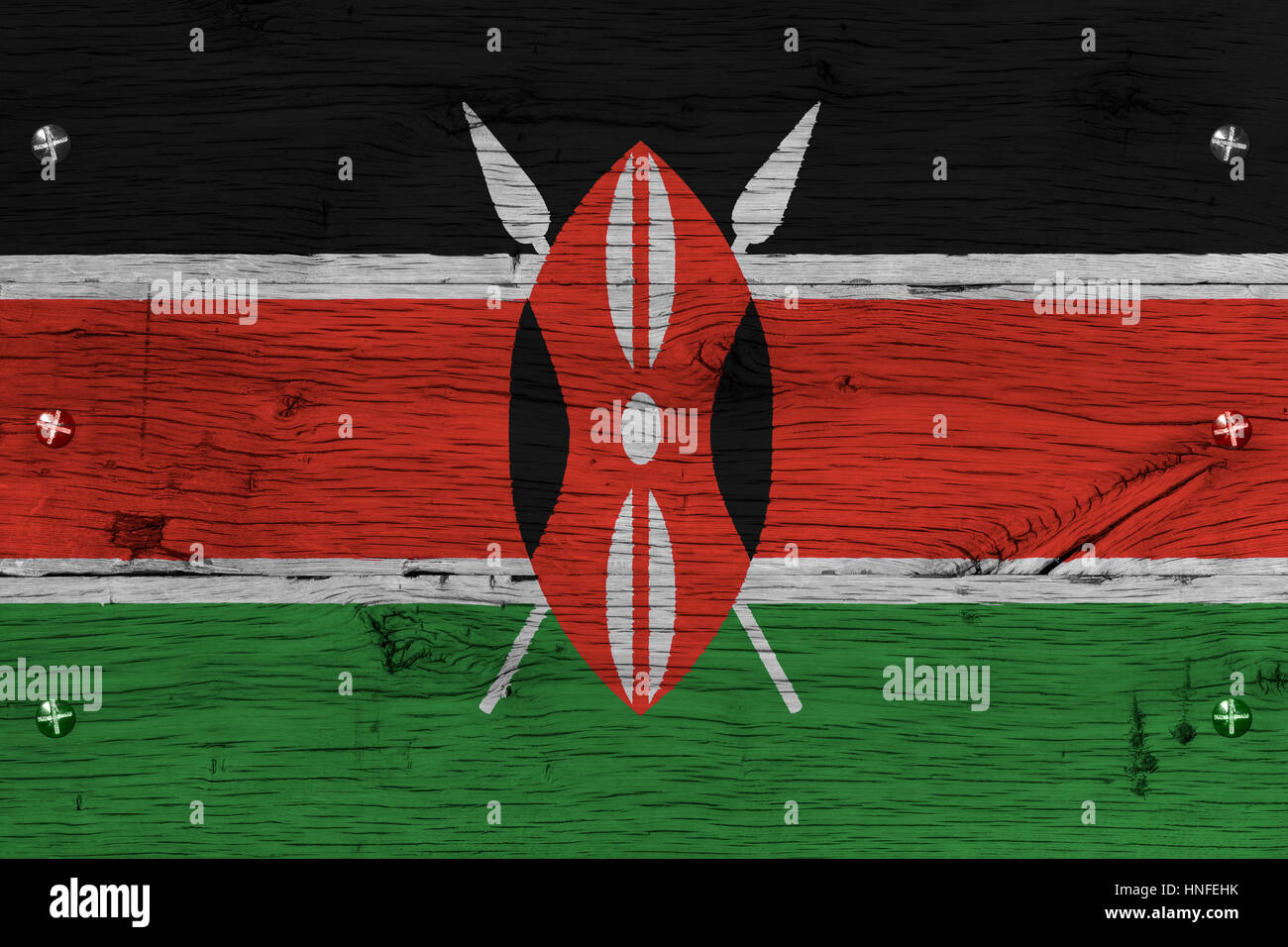 Kenya national flag painted on old oak wood. Painting is colorful on planks of train carriage. Fastened by screws or bolts. Stock Photo