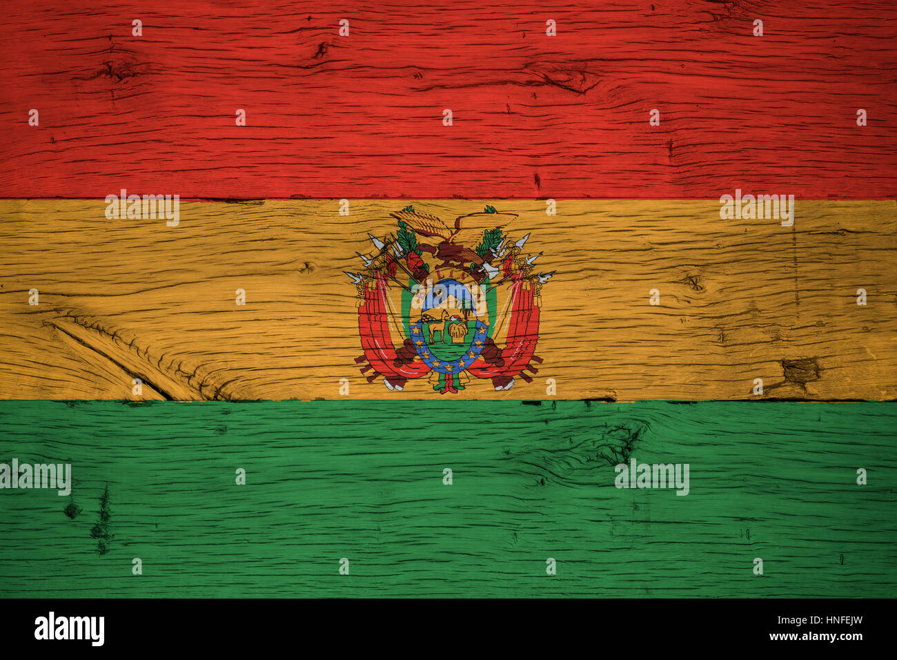 Bolivia national flag with coat of arms or crest painted on old oak wood. Painting is colorful on planks of old train carriage. Stock Photo