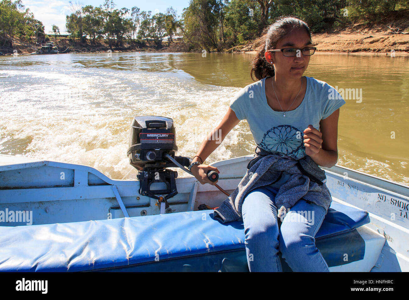 Driving a boat Stock Photo - Alamy