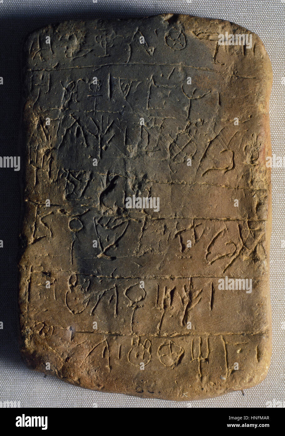 Clay tablet. Linear A. Writing system: hieroglyphic script. Minoan civilization. 2500-1450 BC. Knossos Palace. Crete. Greece. Archeological Museum of Heraklion. Crete. Greece. Stock Photo