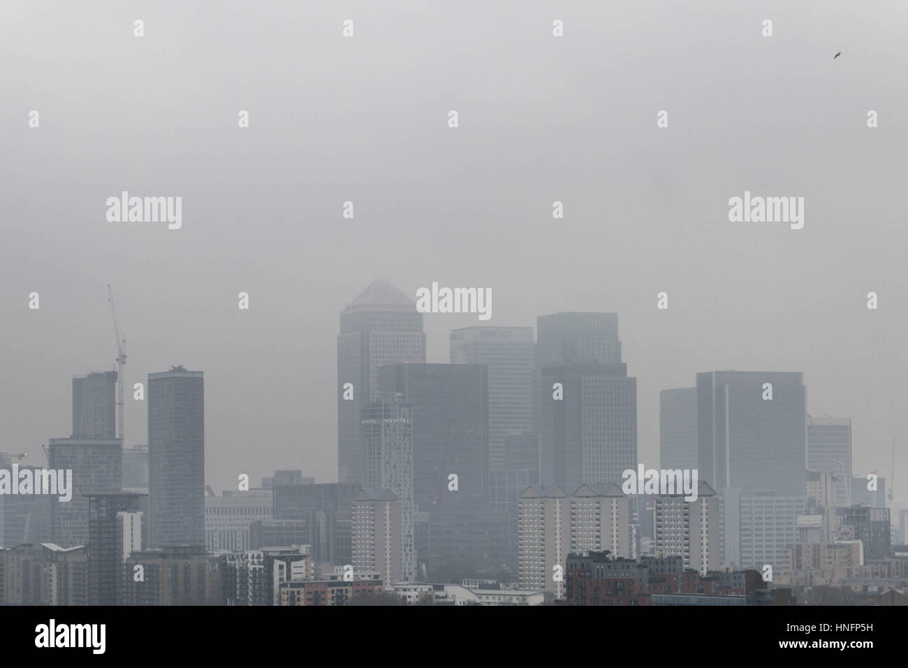 London, UK. 12th February, 2017. UK Weather: Fog over London and Canary Wharf business park buildings © Guy Corbishley/Alamy Live News Stock Photo