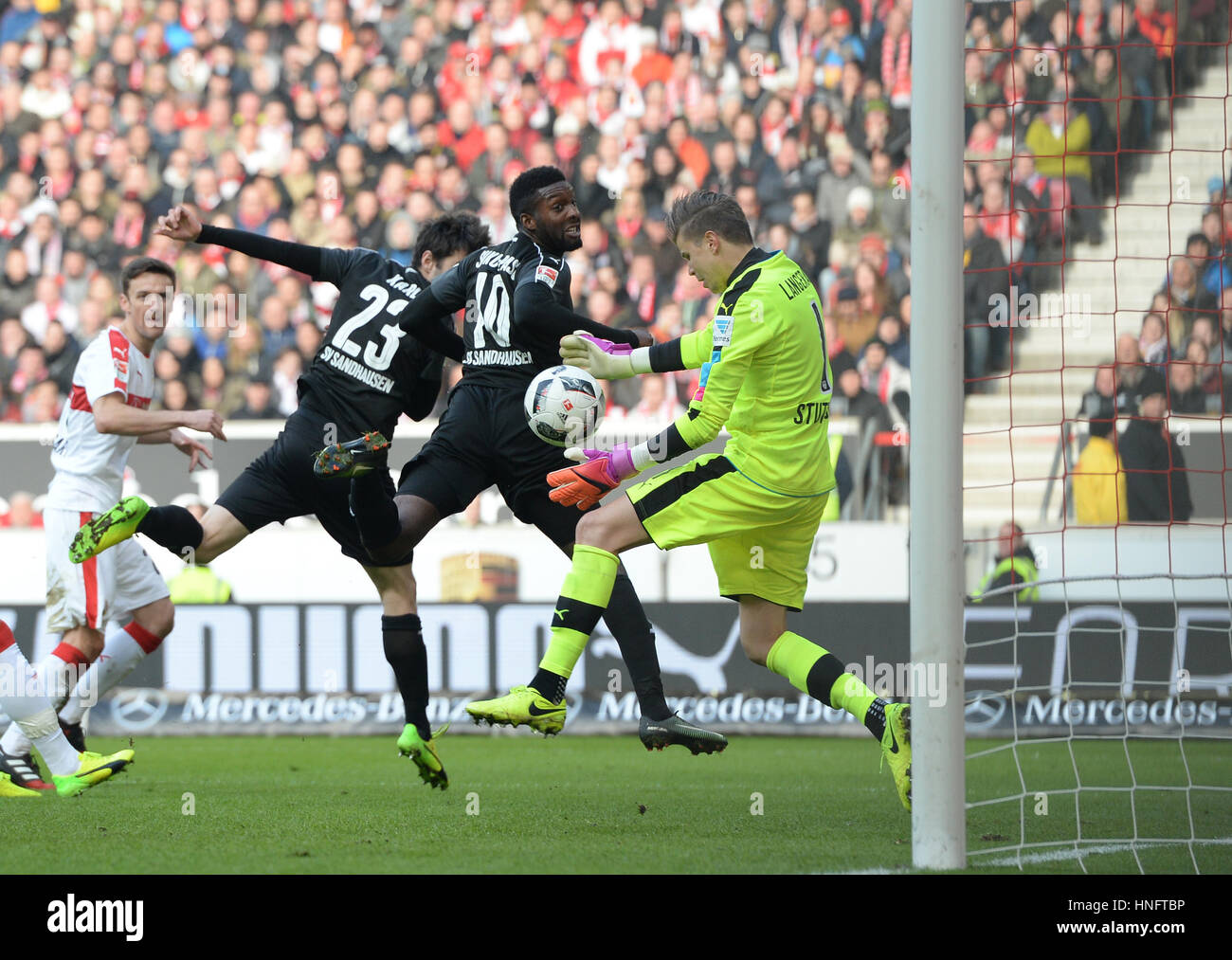 Stuttgart, Germany. 12th Feb, 2017. Stuttgart's goalkeeper Mitchell Langerak (R) in action against Sandhausen's Markus Karl (L) and Richard Sukuta Paso (C) during the German second division Bundesliga soccer match between VfB Stuttgart and SV Sandhausen in the Mercedes Benz Arena in Stuttgart, Germany, 12 February 2017. (EMBARGO CONDITIONS - ATTENTION: Due to the accreditation guidelines, the DFL only permits the publication and utilisation of up to 15 pictures per match on the internet and in online media during the match.) Photo: Deniz Calagan/dpa/Alamy Live News Stock Photo