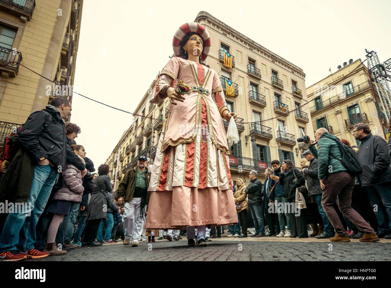 Barcelona, Spain. 12th Feb, 2017. The 'Gegant' (giant) dances among the crowd in front of Barcelona's town hall during the Santa Eulalia festival Credit: Matthias Oesterle/Alamy Live News Stock Photo