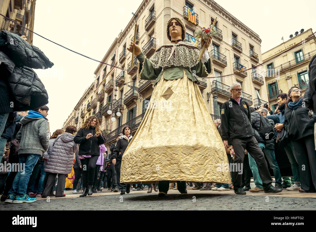 Barcelona, Spain. 12th Feb, 2017. The 'Gegant' (giant) dances among the crowd in front of Barcelona's town hall during the Santa Eulalia festival Credit: Matthias Oesterle/Alamy Live News Stock Photo