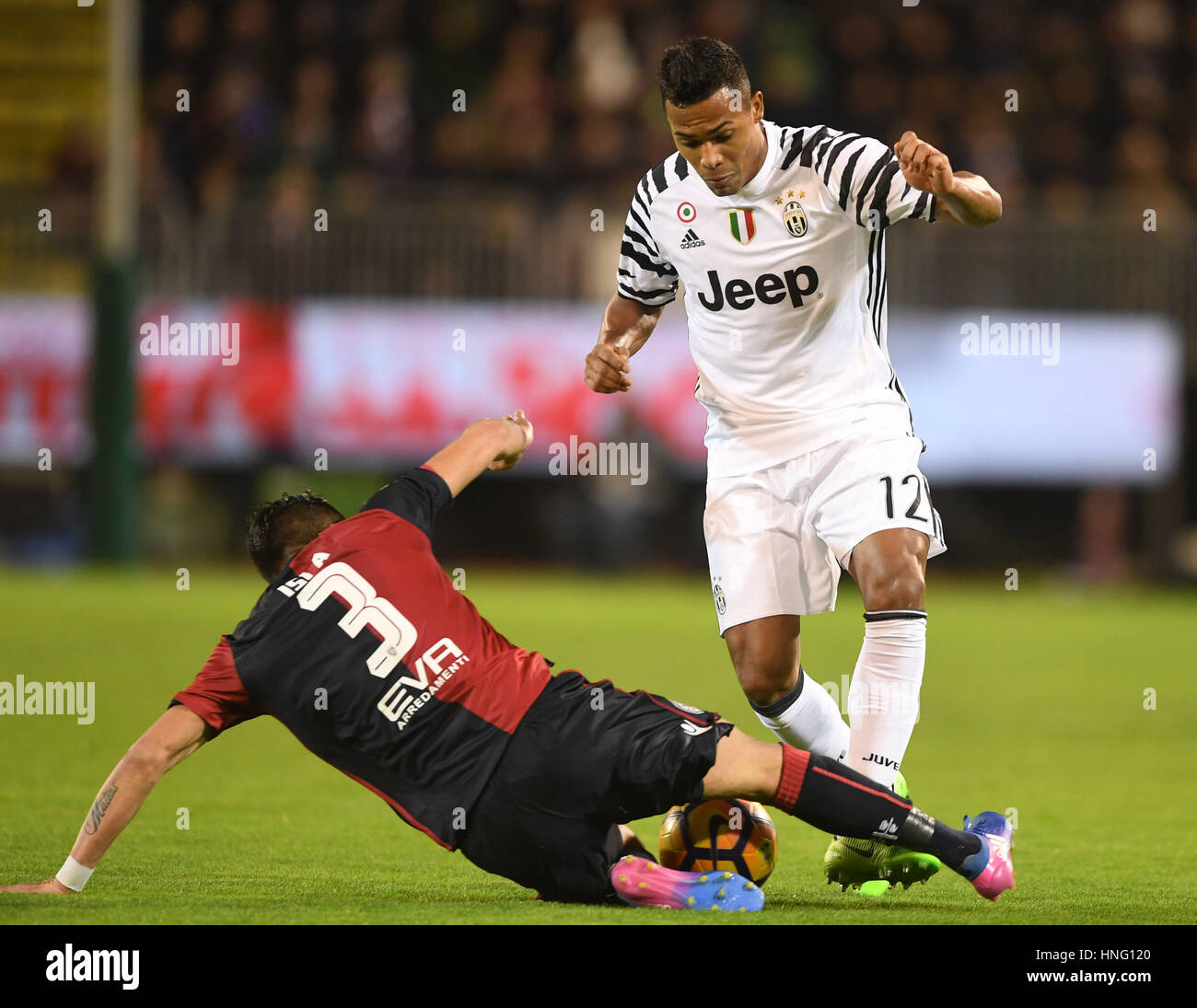 Cagliari, Italy. 12th Feb, 2017. Cagliari's Mauricio Isla(L) vies with Juventus' Alex Sandro during the Serie A soccer match between Juventus and Cagliari, in Cagliari, Italy, Feb. 12, 2017. Juventus won 2-0. Credit: Alberto Lingria/Xinhua/Alamy Live News Stock Photo