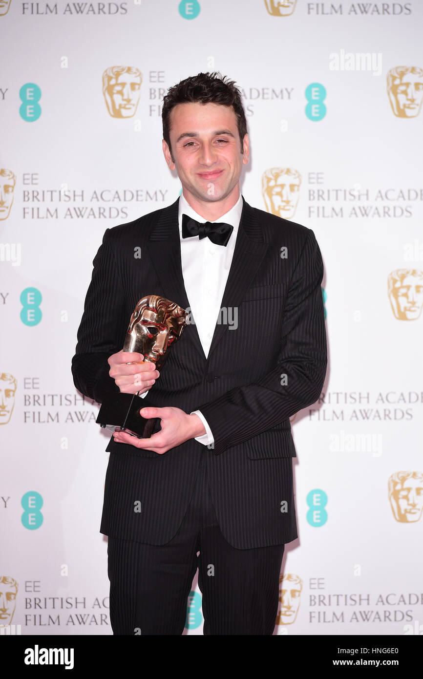 Justin Hurwitz with the award for Original Music for the film La La Land in the press room during the EE British Academy Film Awards held at the Royal Albert Hall, Kensington Gore, Kensington, London. Stock Photo