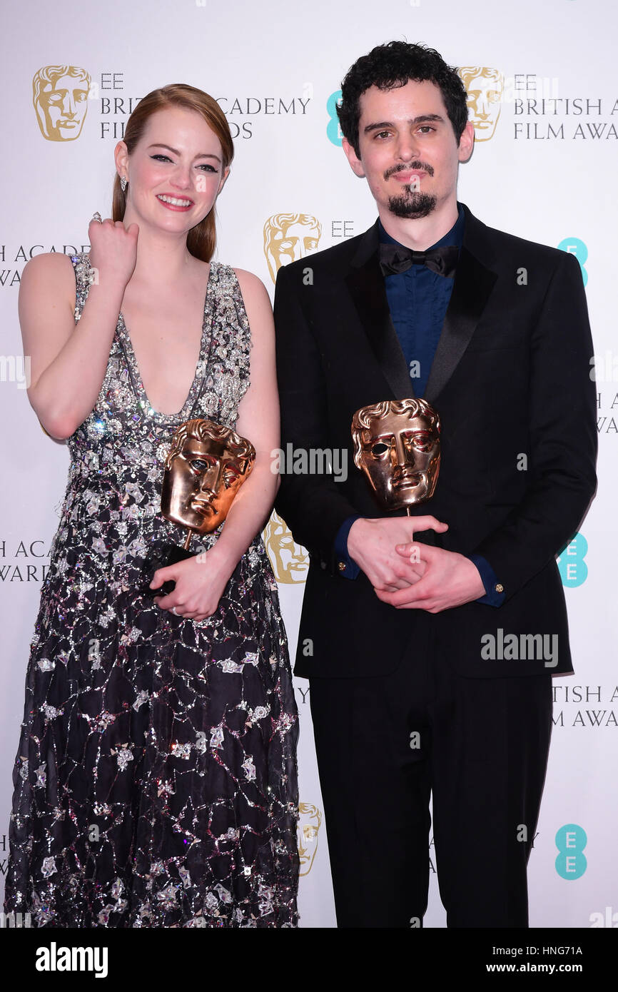 Emma Stone with the award for Leading Actress in the film La La Land alongside Director Damien Chazelle in the press room during the EE British Academy Film Awards held at the Royal Albert Hall, Kensington Gore, Kensington, London. Stock Photo
