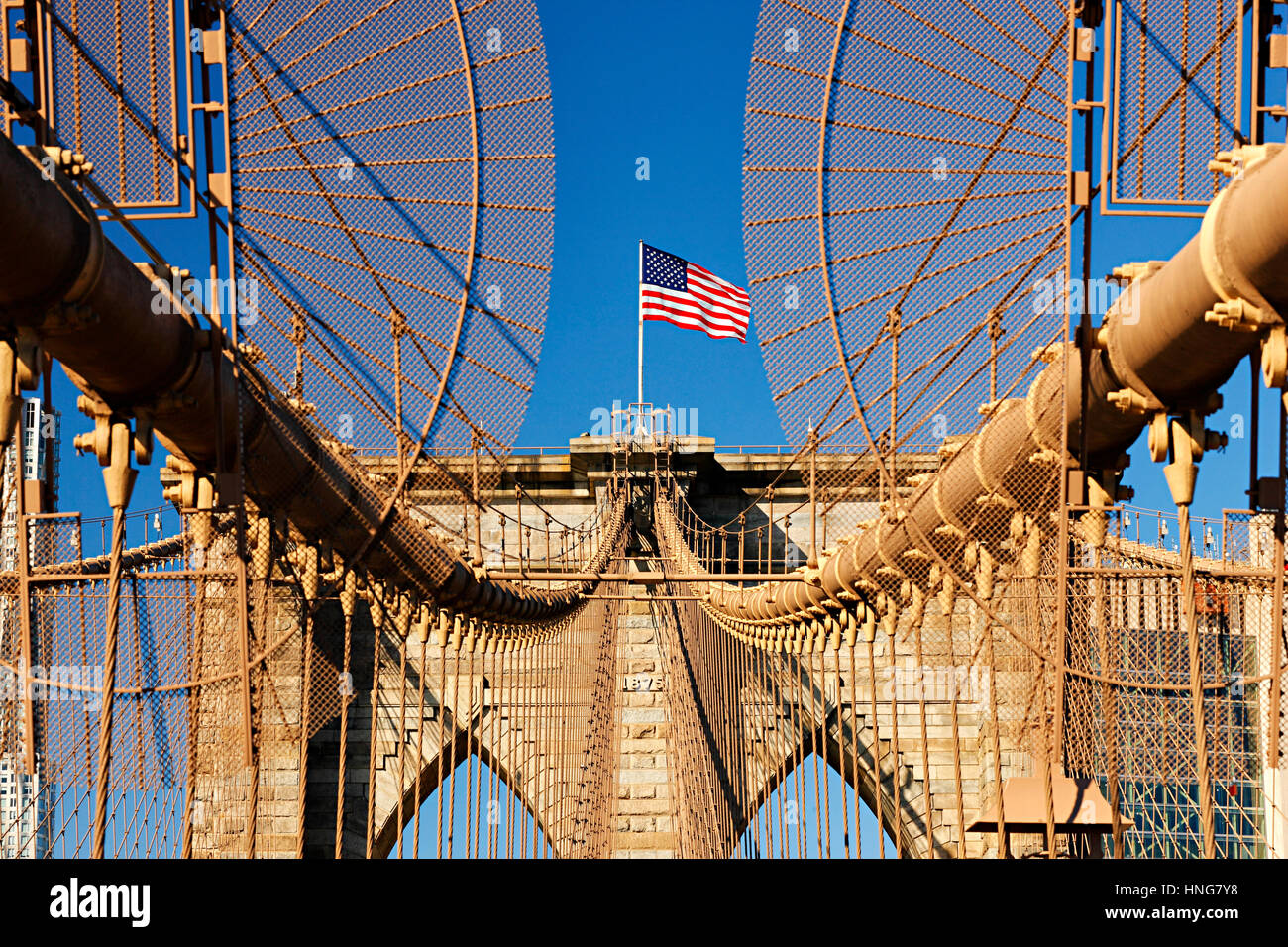 American flag on Brooklyn Bridge in New York City Stock Photo