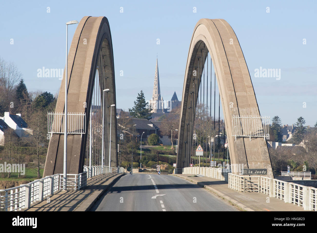 1954 bridge, Le Pont Canada over the Jaudy River and the steeple of gothic cathedral dedicated to Saint Tugdual at Treguier, France Stock Photo