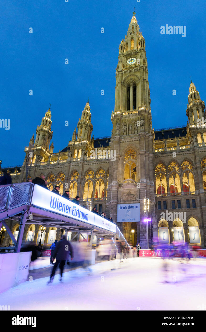 Floodlit ice-skating outside the Rathaus (Town Hall), Vienna, Austria Stock Photo
