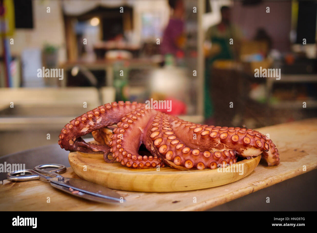 Boiled octopus on food street stall.Pulpo ala gallega. Stock Photo