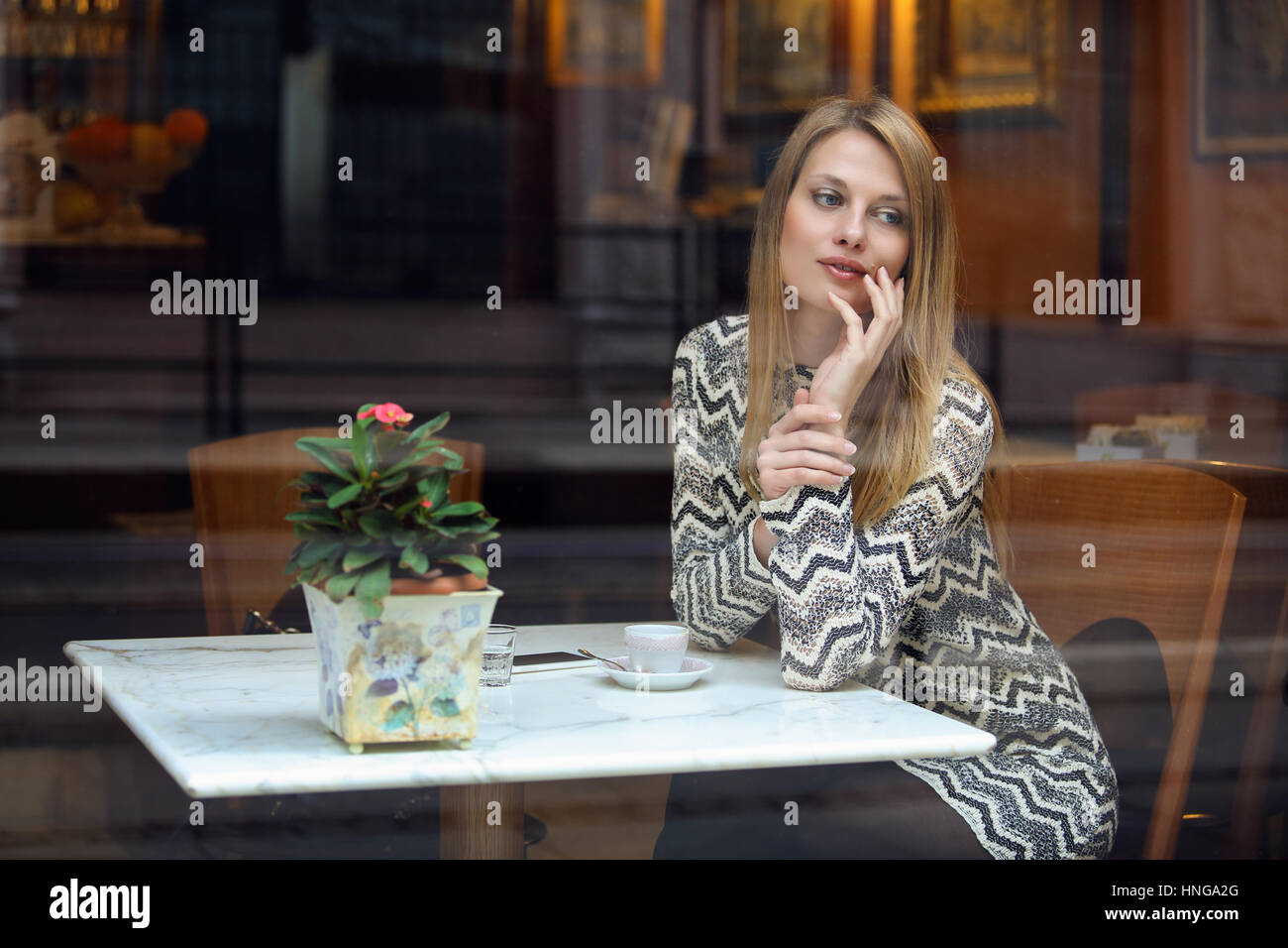 Elegant young woman in a classy cafe. Urban shot Stock Photo