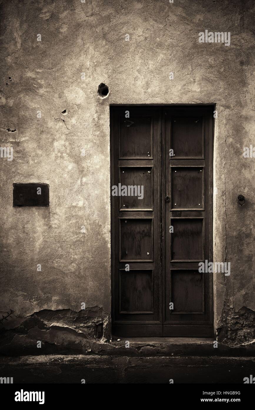 Vintage door and wall in Florence in Italy Stock Photo