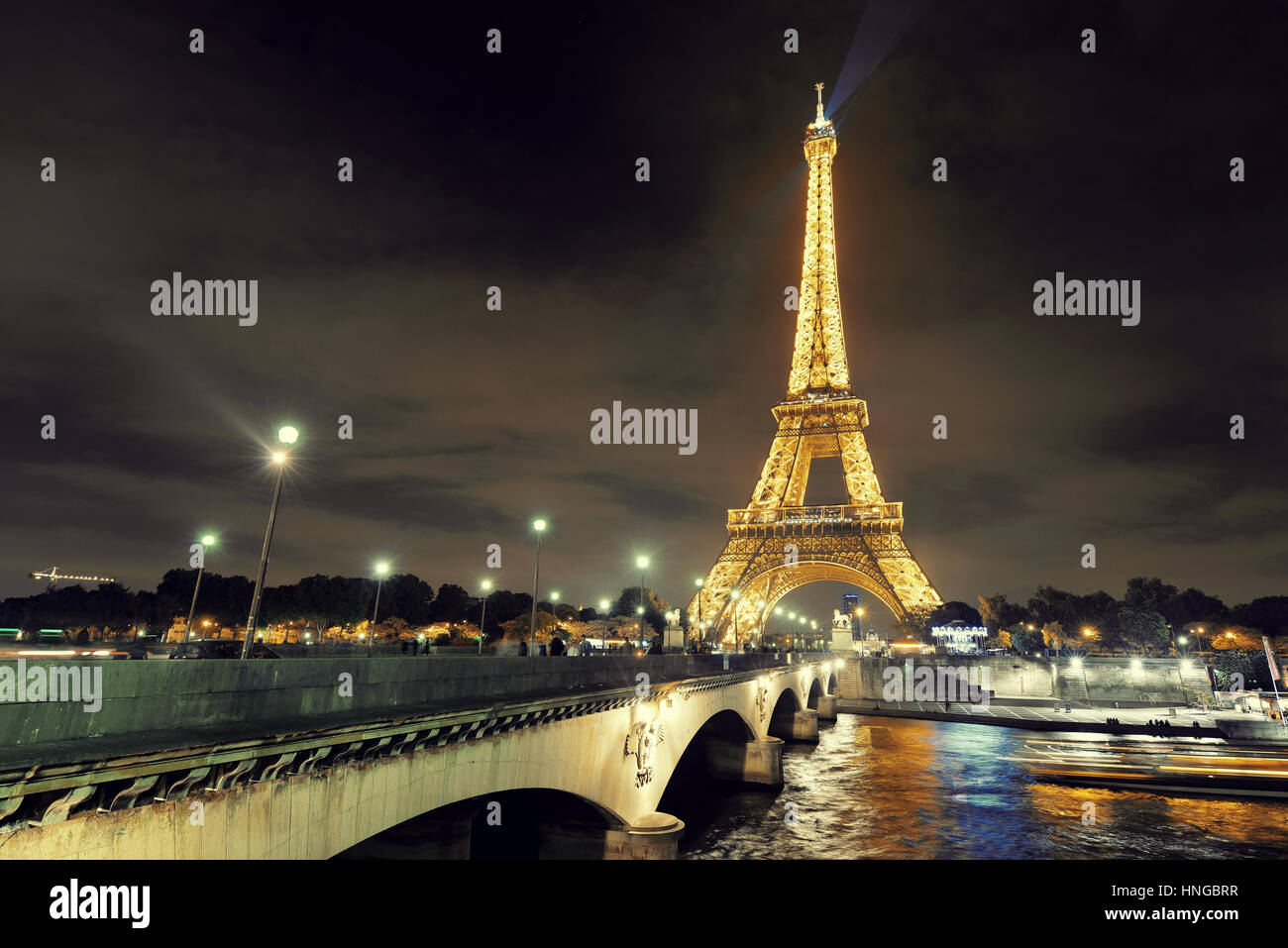 PARIS, FRANCE - MAY 13: Eiffel Tower at night on May 13, 2015 in Paris. It is the most-visited paid monument in the world with annual 250M visitors. Stock Photo