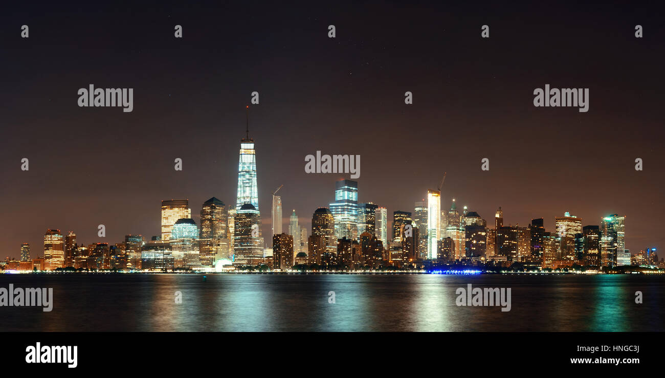 New York City downtown skyline at night panorama over Hudson River ...