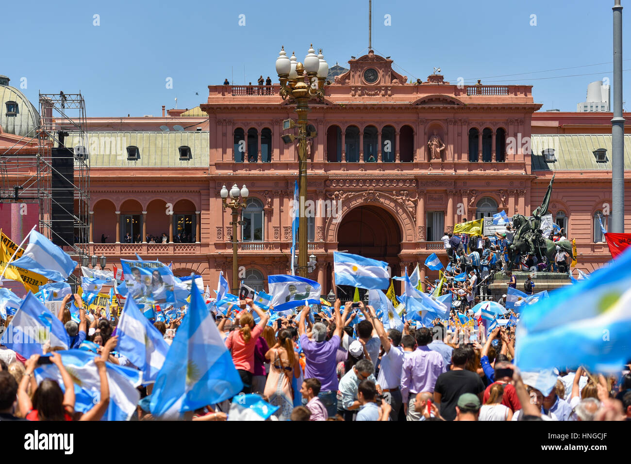 Buenos Aires, Argentina - Dec 10, 2015: Supporters of the newly elected Argentinean president wave flags on inauguration day at the Plaza de Mayo. Stock Photo